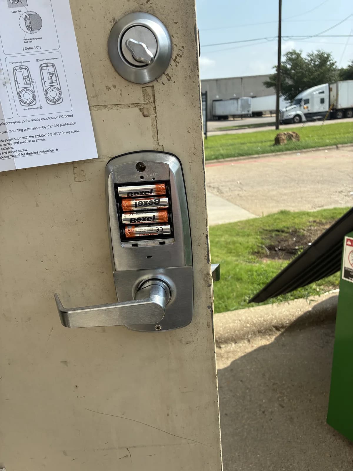 Electronic keypad lock and lever installed on an exterior door