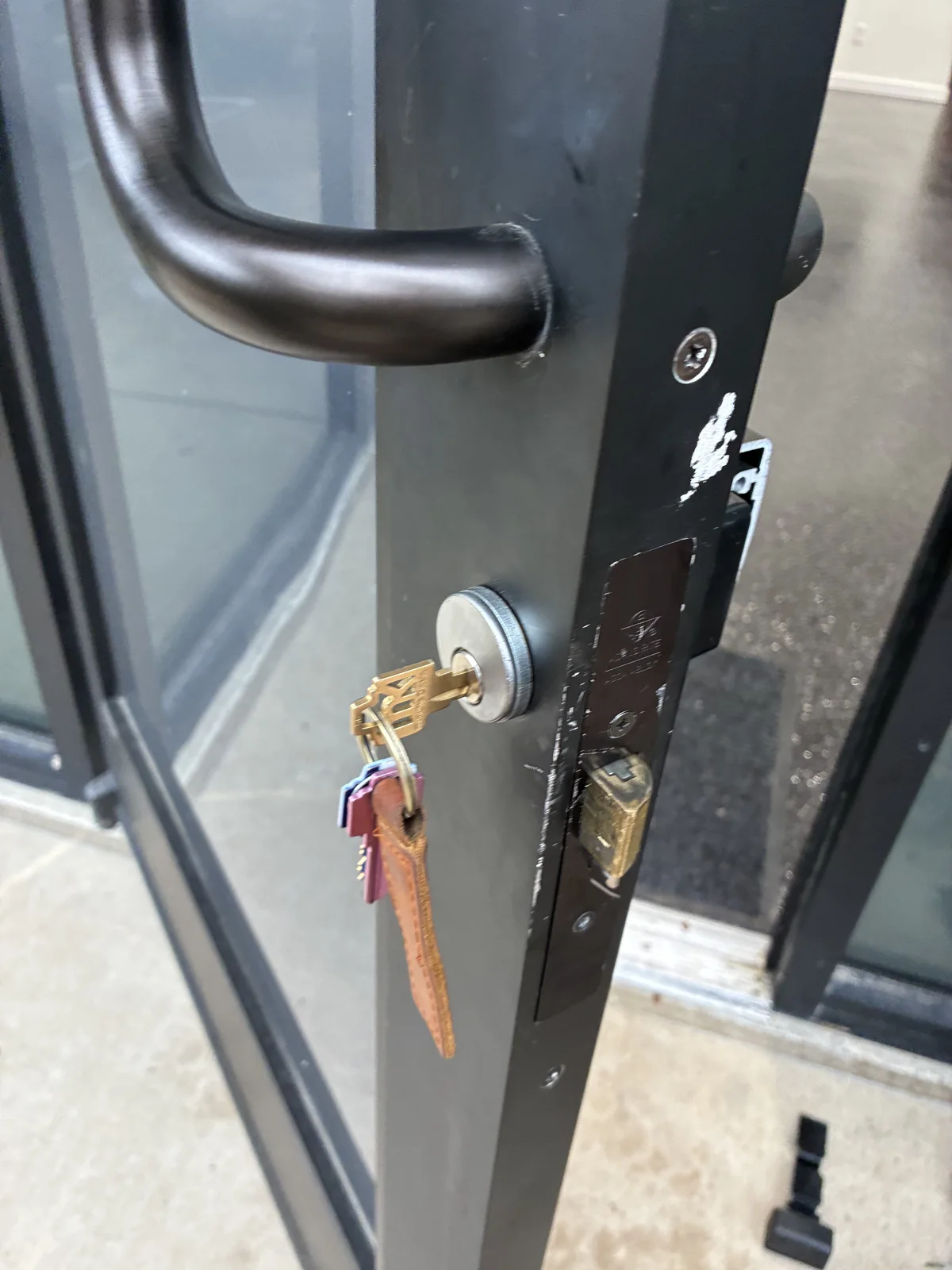 Key inserted into a commercial door cylinder and lever handle
